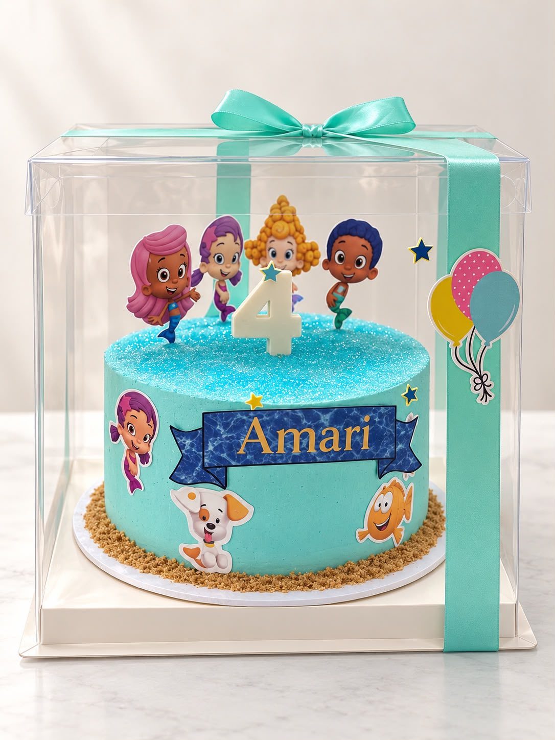 Bubble Guppies 4th birthday cake in a gift box